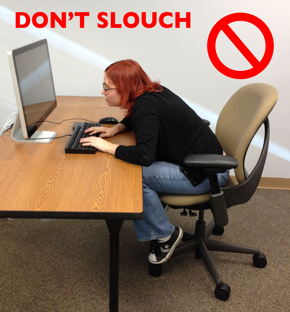 woman slouching over her keyboard 